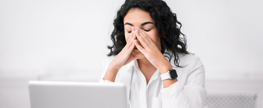 Woman Looking at Computer is Disbelief 