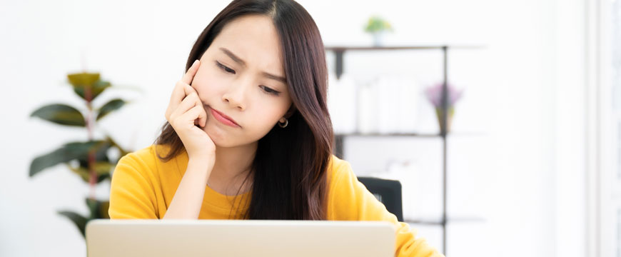 Girl Looking at a Computer Screen Confused